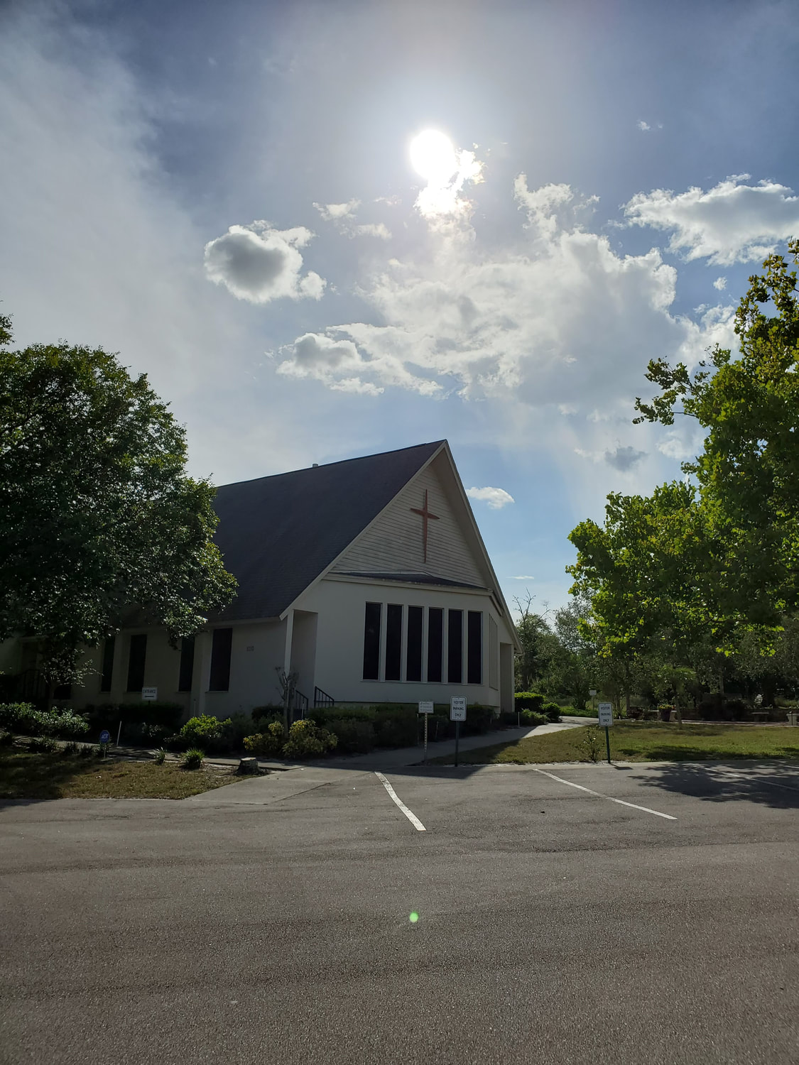The church building and parking lot along Bear Lake Road.